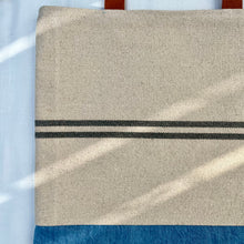 Load image into Gallery viewer, Tote bag. Heavyweight natural woven canvas with two horizontal blue grey stripes and light blue cotton denim bottom.