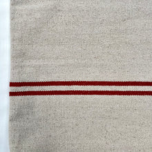 Load image into Gallery viewer, Tote bag. Heavyweight natural woven canvas with two horizontal red stripes. Lined with an ex-designer striped cotton shirting fabric.