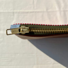 Load image into Gallery viewer, White and red striped denim fabric and brown leather Pouch with zip. Zippered purse. Zippered pouch. Cotton and leather. YKK zipper.