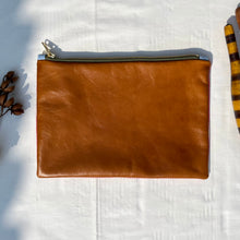 Load image into Gallery viewer, White and red striped denim fabric and brown leather Pouch with zip. Zippered purse. Zippered pouch. Cotton and leather. YKK zipper.