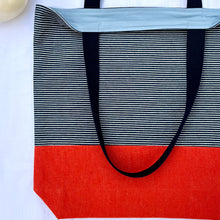 Load image into Gallery viewer, One of a kind bag. Tote Bag. Navy blue and white stripe cotton denim with an organic orange cotton denim bottom.