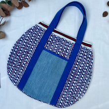 Load image into Gallery viewer, Block print bowling bag. Blue and white cotton print with red visible stitch. Red, navy blue and white knit cuff.