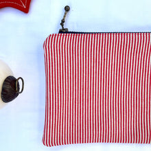 Load image into Gallery viewer, Red and white striped denim fabric and ginger brown leather Pouch with zip. Zippered purse. Zippered pouch. Cotton and leather. YKK zipper.