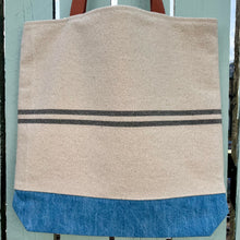 Load image into Gallery viewer, Tote bag. Heavyweight natural woven canvas with two horizontal blue grey stripes and light blue cotton denim bottom.