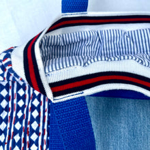 Load image into Gallery viewer, Block print bowling bag. Blue and white cotton print with red visible stitch. Red, navy blue and white knit cuff.