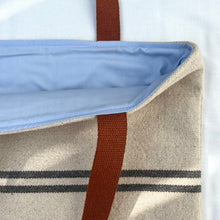 Load image into Gallery viewer, Tote bag. Heavyweight natural woven canvas with two horizontal blue grey stripes and light blue cotton denim bottom.