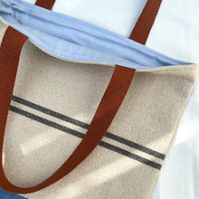Load image into Gallery viewer, Tote bag. Heavyweight natural woven canvas with two horizontal blue grey stripes and light blue cotton denim bottom.
