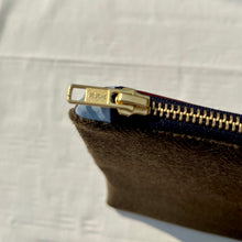 Load image into Gallery viewer, Olive green herringbone pattern wool and leather pouch. 2-material Pouch with YKK zip. Zippered purse. Zippered pouch.