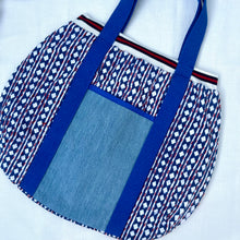 Load image into Gallery viewer, Block print bowling bag. Blue and white cotton print with red visible stitch. Red, navy blue and white knit cuff.