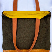 Load image into Gallery viewer, Tote bag. Luxurious dark olive green tweed wool fabric and saddle brown leather round bottom.