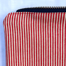Load image into Gallery viewer, Red and white striped denim fabric and ginger brown leather Pouch with zip. Zippered purse. Zippered pouch. Cotton and leather. YKK zipper.