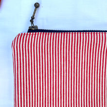 Load image into Gallery viewer, Red and white striped denim fabric and ginger brown leather Pouch with zip. Zippered purse. Zippered pouch. Cotton and leather. YKK zipper.