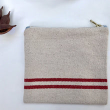 Load image into Gallery viewer, Natural woven canvas pouch with red horizontal stripes. Zippered purse. Zippered pouch. YKK metal zipper.