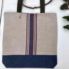 Load image into Gallery viewer, Tote bag. Vintage cotton and hemp grain sack. Blue and red stripes. Blue denim bottom.