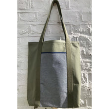 Load image into Gallery viewer, Tote bag. light khaki green canvas shopper bag with a deep front navy blue stripes denim pocket. 100% cotton.