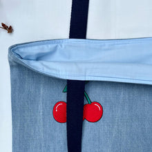 Load image into Gallery viewer, Unique tote bag. Light blue denim with embroidered patches and a vintage grain sack bottom.