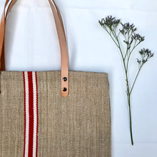 Load image into Gallery viewer, Tote bag. Vintage grain sack tote bag with brown leather straps. Handwoven. Vertical red and leather white stripes.