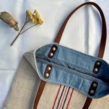 Load image into Gallery viewer, Tote bag. Vintage grain sack tote bag with leather straps. Vertical deep red stripes.