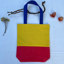 Load image into Gallery viewer, Tote bag. Vibrant yellow and red cotton canvas tote bag. Lined with a royal blue pattern cotton fabric.