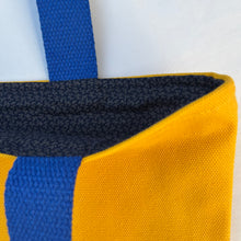 Load image into Gallery viewer, Tote bag. Canary yellow and blue denim cotton canvas tote bag. Lined with a midnight blue pattern cotton fabric.