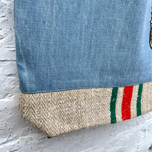 Load image into Gallery viewer, Unique tote bag. Light blue denim with embroidered patches and a vintage grain sack bottom.