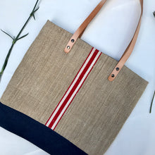Load image into Gallery viewer, Tote bag. Vintage grain sack tote bag with brown leather straps. Handwoven. Vertical red and leather white stripes.