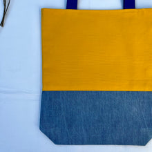 Load image into Gallery viewer, Tote bag. Canary yellow and blue denim cotton canvas tote bag. Lined with a midnight blue pattern cotton fabric.