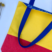 Load image into Gallery viewer, Tote bag. Vibrant yellow and red cotton canvas tote bag. Lined with a royal blue pattern cotton fabric.