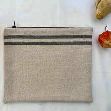 Load image into Gallery viewer, Cream woven canvas pouch with two horizontal grey stripes. YKK zip. Zippered purse. Zippered pouch. YKK zipper.
