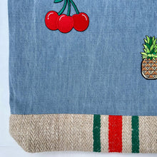 Load image into Gallery viewer, Unique tote bag. Light blue denim with embroidered patches and a vintage grain sack bottom.