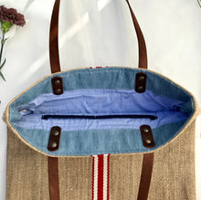 Load image into Gallery viewer, Tote bag. Vintage grain sack tote bag with brown leather straps. Handwoven. Vertical red and leather white stripes.