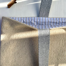 Load image into Gallery viewer, Tote bag. Heavyweight natural woven canvas with two horizontal sand-coloured stripes. Lined with a striped cotton shirting fabric.