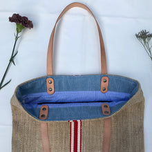 Load image into Gallery viewer, Tote bag. Vintage grain sack tote bag with brown leather straps. Handwoven. Vertical red and leather white stripes.