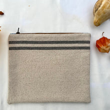 Load image into Gallery viewer, Cream woven canvas pouch with two horizontal grey stripes. YKK zip. Zippered purse. Zippered pouch. YKK zipper.