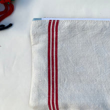 Load image into Gallery viewer, Red striped linen fabric and indigo blue denim fabric pouch. 2-fabric pouch. Zippered purse. Zippered pouch. YKK metal zipper.
