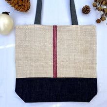 Load image into Gallery viewer, Tote bag. Vintage grain sack tote bag. Vertical burgundy stripe and indigo blue denim bottom.
