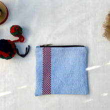 Load image into Gallery viewer, Light blue dyed French linen pouch with small red embroidered squares. Zippered purse. Zippered pouch. YKK metal zipper.
