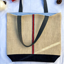 Load image into Gallery viewer, Tote bag. Vintage grain sack tote bag. Handwoven. Vertical blue and red stripes. Indigo blue denim.

