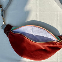 Load image into Gallery viewer, One-of-a-kind tote sling bag. Gorgeous mint green and rust cotton corduroy. Lined with a navy blue and burgundy striped cotton poplin fabric.
