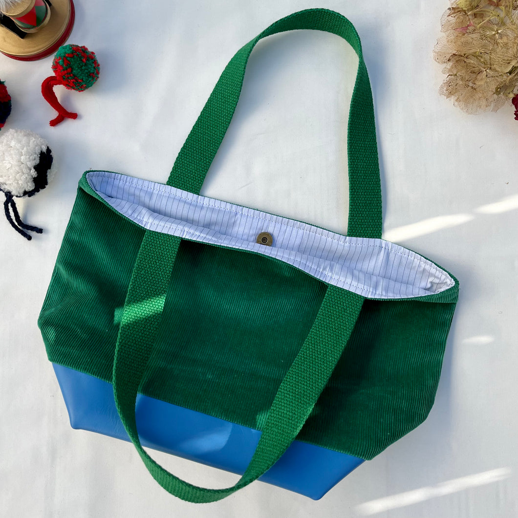 xs Handbag. Bag. Ex designer green cotton needlecord and blue leather handbag.