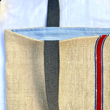 Load image into Gallery viewer, Tote bag. Vintage grain sack tote bag. Handwoven. Vertical blue and red stripes. Indigo blue denim.
