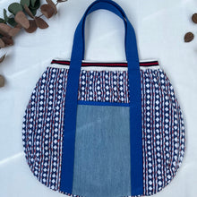 Load image into Gallery viewer, Block print bowling bag. Blue and white cotton print with red visible stitch. Red, navy blue and white knit cuff.
