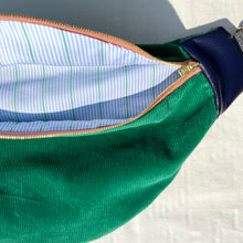 Load image into Gallery viewer, One-of-a-kind tote sling bag. Luxurious green cotton needlecord. With navy blue leather sides. Lined with a gorgeous blue and green striped cotton poplin fabric.
