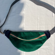 Load image into Gallery viewer, One-of-a-kind tote sling bag. Luxurious green cotton needlecord. With navy blue leather sides. Lined with a gorgeous blue and green striped cotton poplin fabric.
