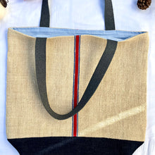 Load image into Gallery viewer, Tote bag. Vintage grain sack tote bag. Handwoven. Vertical blue and red stripes. Indigo blue denim.
