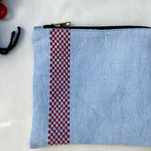 Load image into Gallery viewer, Light blue dyed French linen pouch with small red embroidered squares. Zippered purse. Zippered pouch. YKK metal zipper.
