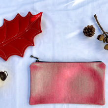 Load image into Gallery viewer, Red and white striped denim fabric and ginger brown leather Pouch with zip. Zippered purse. Zippered pouch. Cotton and leather. YKK zipper.
