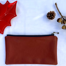 Load image into Gallery viewer, Red and white striped denim fabric and ginger brown leather Pouch with zip. Zippered purse. Zippered pouch. Cotton and leather. YKK zipper.
