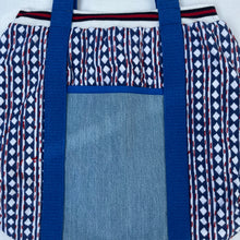 Load image into Gallery viewer, Block print bowling bag. Blue and white cotton print with red visible stitch. Red, navy blue and white knit cuff.
