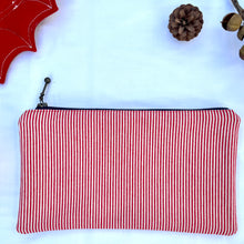 Load image into Gallery viewer, Red and white striped denim fabric and ginger brown leather Pouch with zip. Zippered purse. Zippered pouch. Cotton and leather. YKK zipper.
